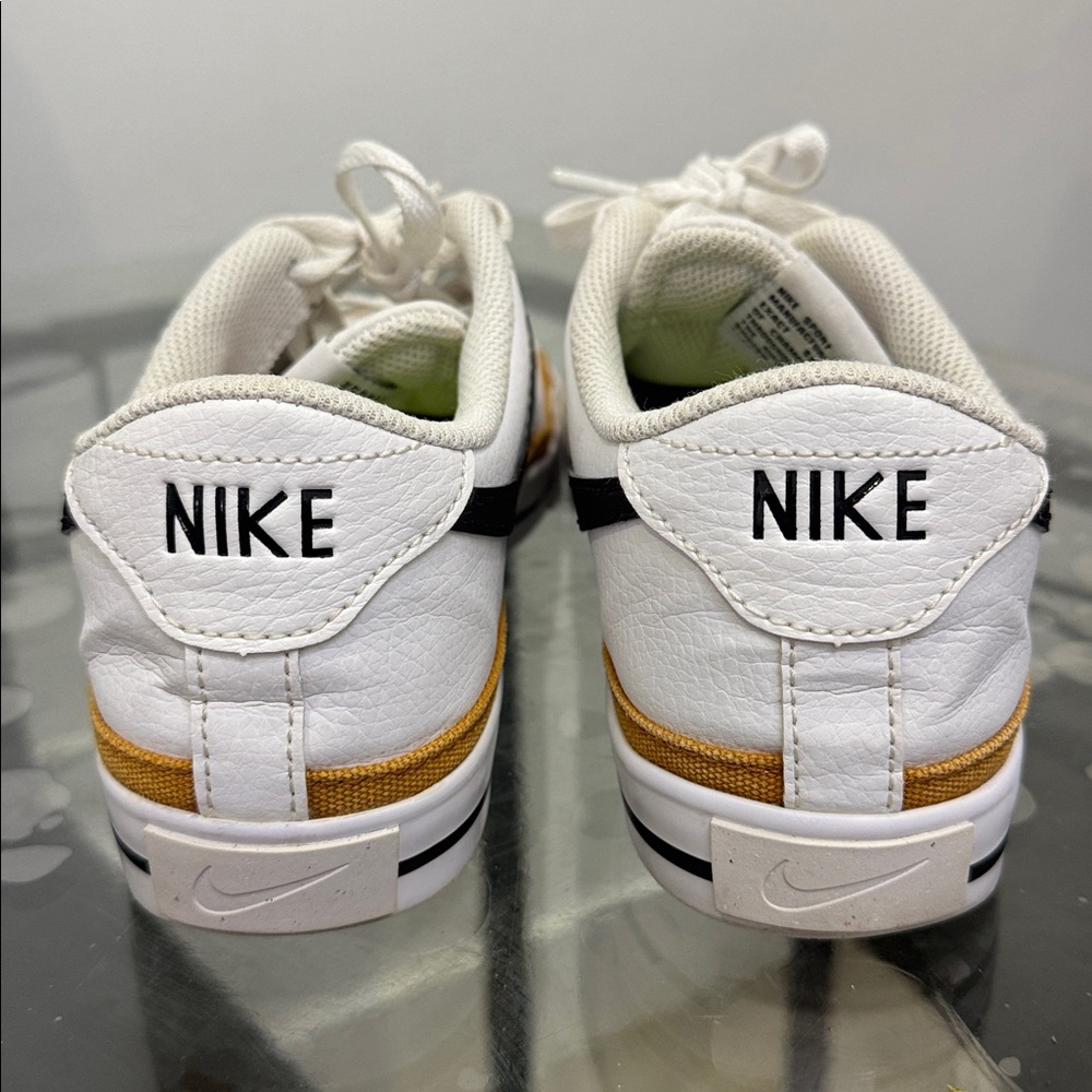 Nike White and Black Sneakers with Gold Accents - Picture 2 of 8
